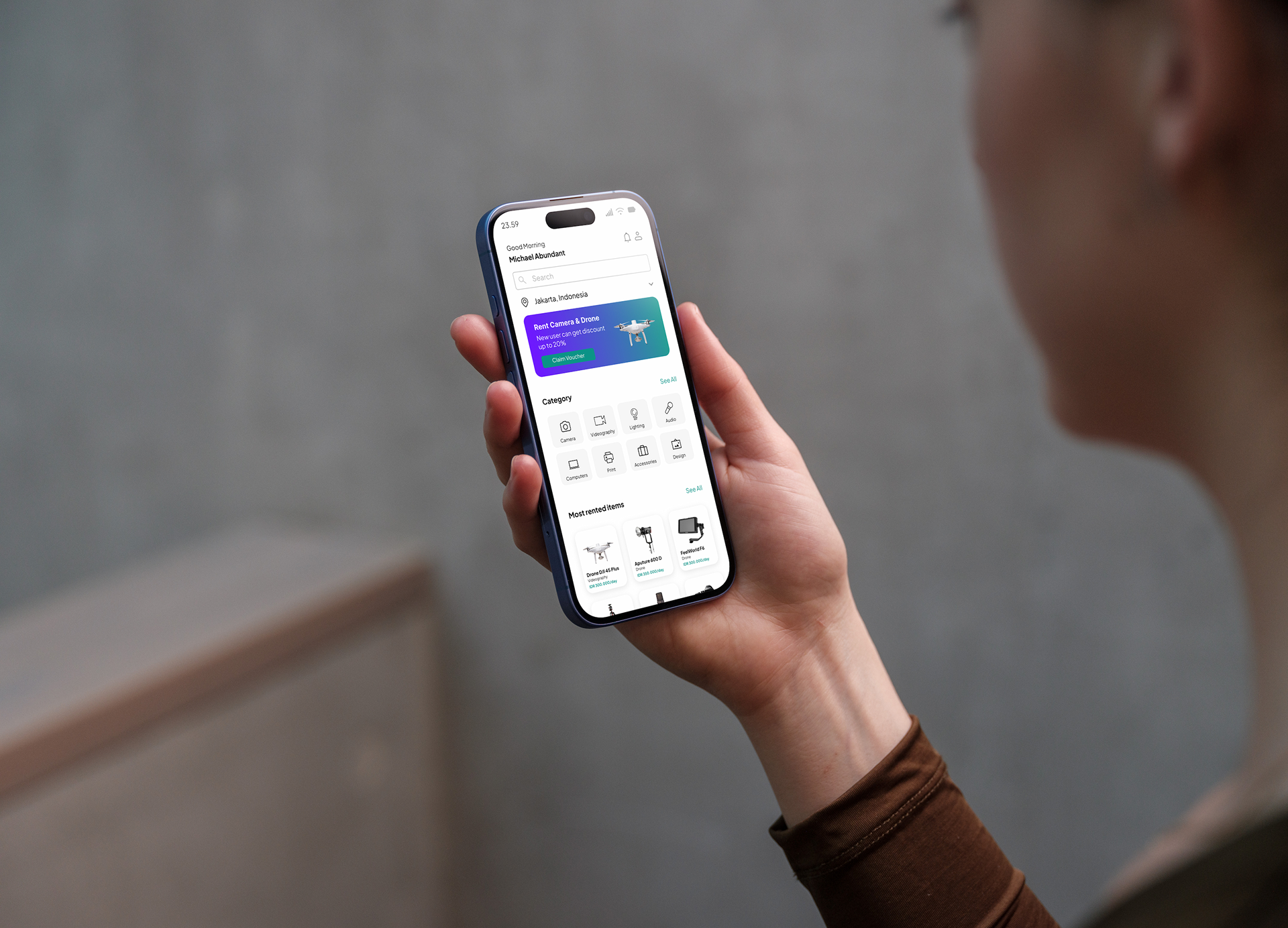 Person Holding Phone - Rental App